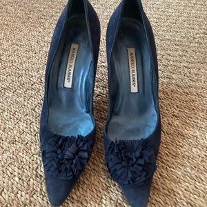 Manolo Blahnik Navy Blue Heels with elegant tone on tone rosette detail.